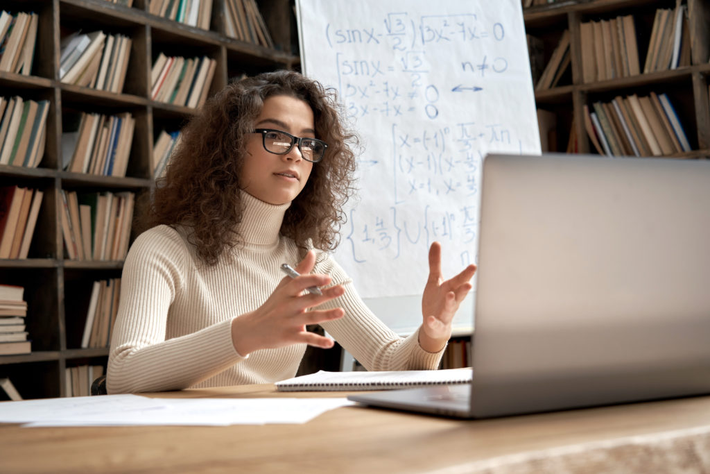 Female Math Teacher at Laptop