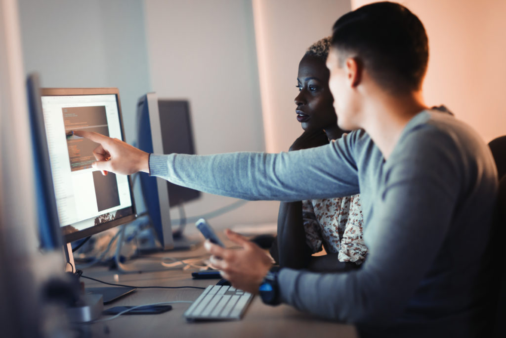 Man Pointing to Computer Screen